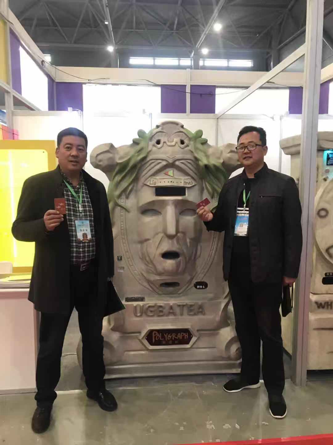 Past customer customization: a tree-inspired machine with two people beside it