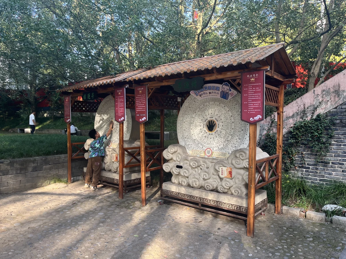 Two existing Lucky Stone kiosks in a garden setting